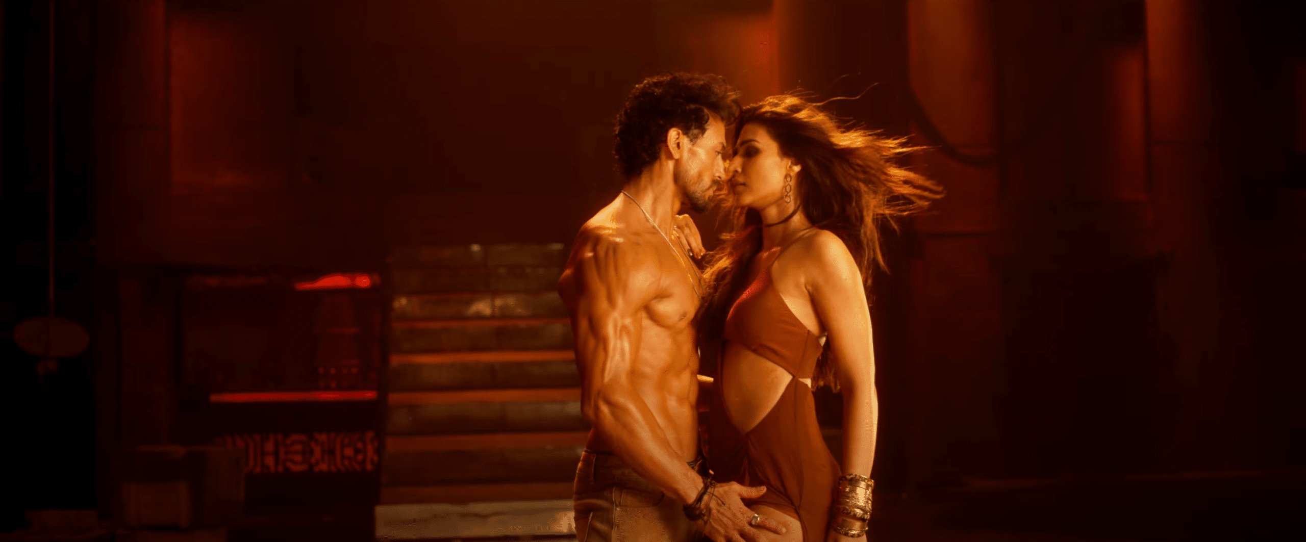 Tiger shroff and kriti sanon grace the screen in a romantic and hot scene in ganapath teaser.